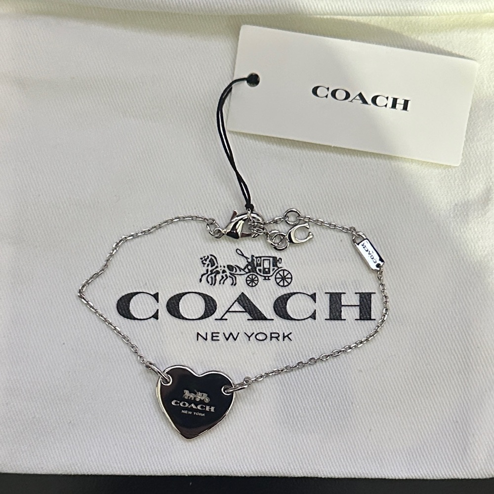 Coach Silver Heart Bracelet with signature  horse and carriage.